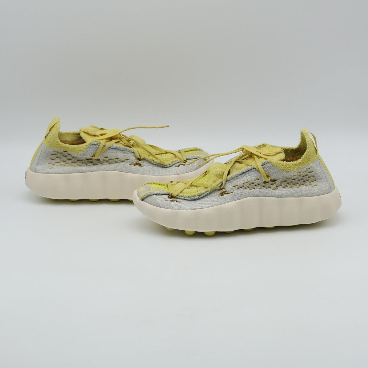 IR2176-003 Nike Mind 002 Flyknit "Light Bone/Saturn Gold" (Men's)
